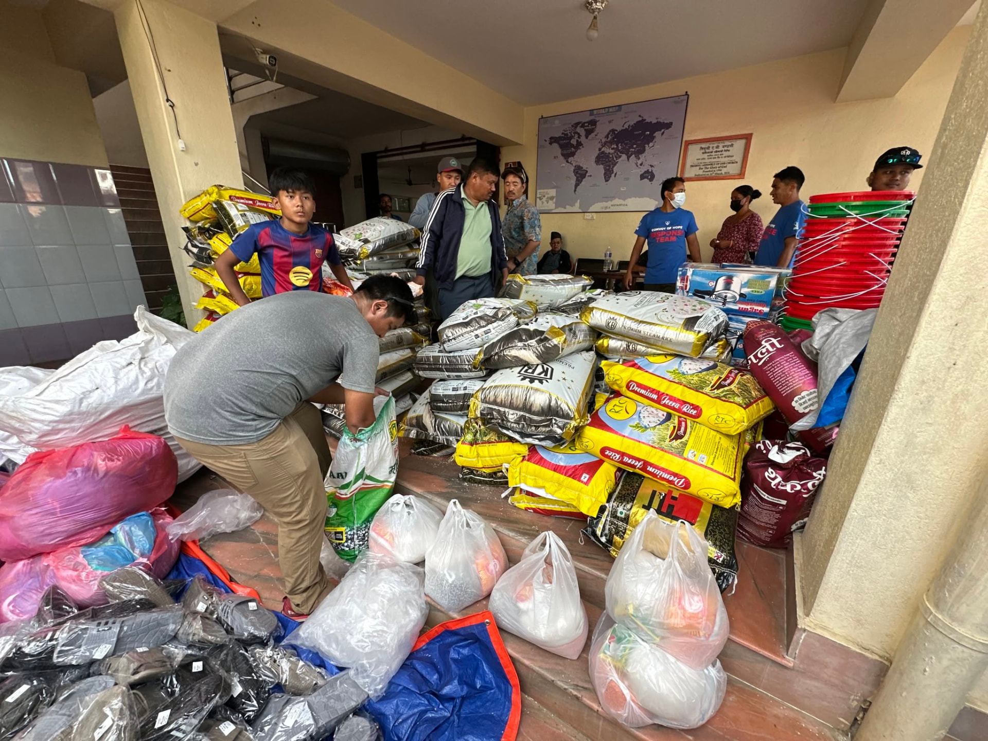 Rice sacks, buckets and clothing staged at the church in Kathmandu