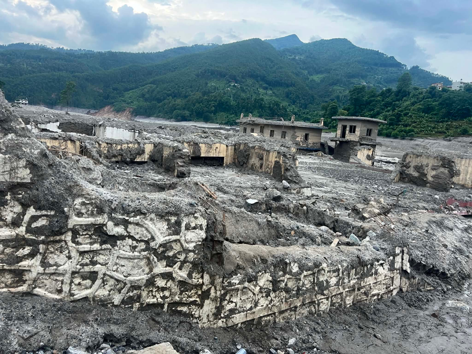 Buildings destroyed along the riverbank by the flood surge